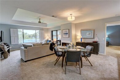 Carpeted dining room featuring a multi sided firep