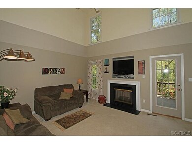 The family room flows into the kitchen and has a h
