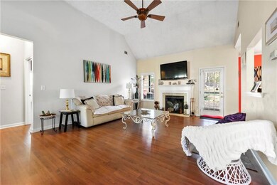 Living area with high vaulted ceiling, wood finish