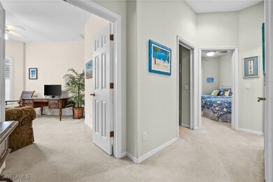 Corridor with light colored carpet