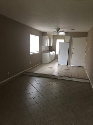 Spare room with tile patterned flooring, ceiling fan, and sink