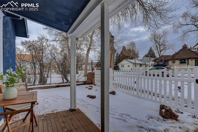 Covered front porch with vinyl fenced front yard