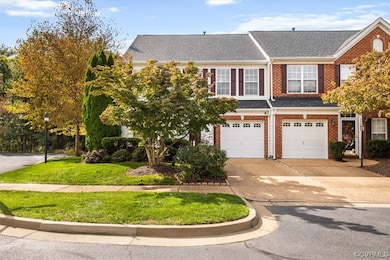 View of front of property with a garage and a front yard