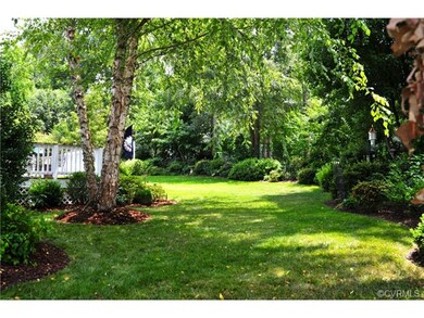 Exquisitely landscaped rear yard that backs up to 