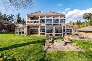 Live large in this 2600 +/- sf custom house on the water...