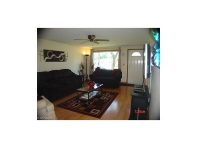 Third view of living room shows the large picture 