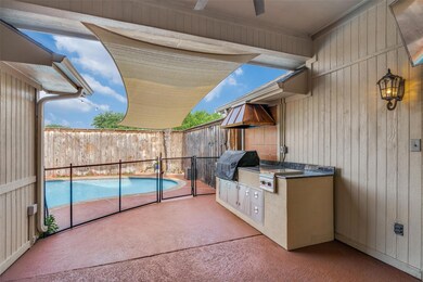 View of patio featuring an outdoor kitchen, grilli