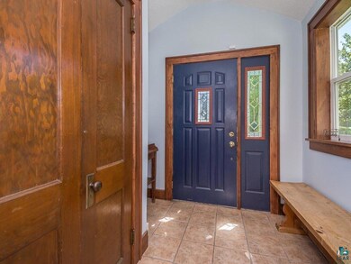 Room for shoes, boots and a bench! Nicely tiled-
