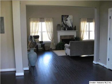 A view into the 2 story great room from the foyer.