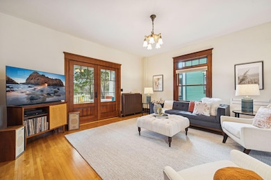 Newer French doors open to the new front porch