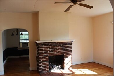 The living room has a fireplace with gas logs to k