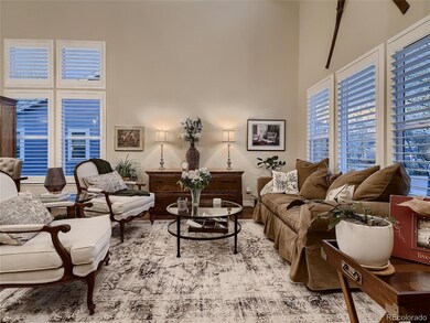 The living room has vaulted ceilings and large win
