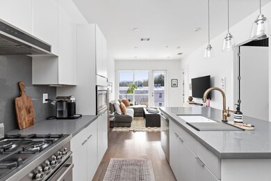 Kitchen with open floor plan, a sink, range hood,