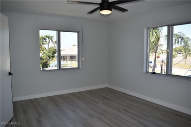 Empty room with wood finished floors, baseboards,