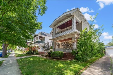 View of home's exterior with garage and a yard