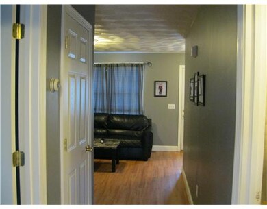 Living Room. Wood Flooring, makes for a wide open