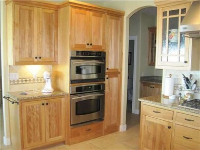 Kitchen with built in refrigerator and tri-vection oven
