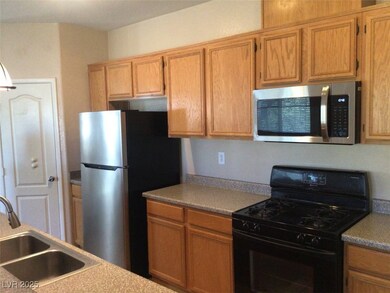 Kitchen with appliances with stainless steel finis