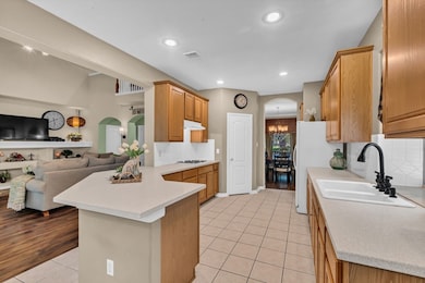 The kitchen opens to the living room.