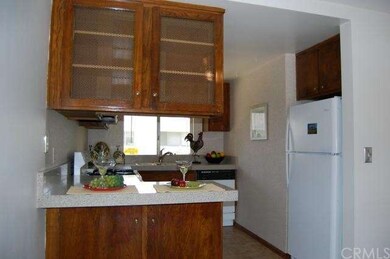 View of the Breakfast Bar. The Refrigerator is als