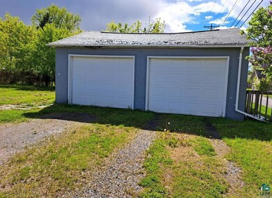 Garage with a lawn