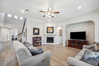 Luxury vinyl plank flooring, high ceilings and neutral colors throughout welcome you into the family room of this home.