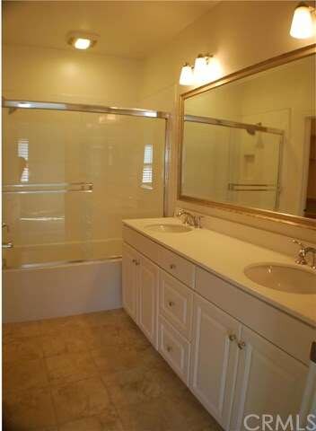 Master Bathroom with double sinks and elegant fram