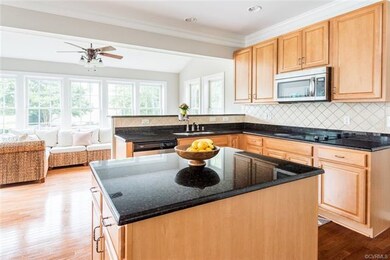 The kitchen is HUGE, and features hardwood floorin