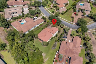 Aerial view of property and surrounding area featuring nearby suburban area