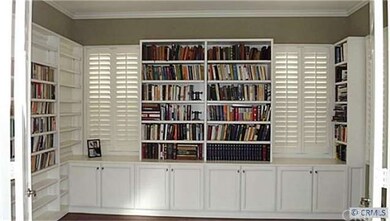 Downstairs office or library has stunning custom b