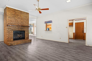 The living room is adjacent to the kitchen and features a pass through window.