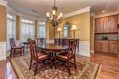 Dining room with by window, wood floors, updated l