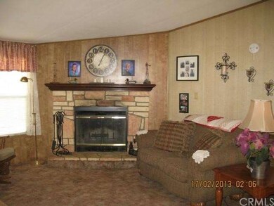 Living Room Stone Faced Fireplace With Raised Hear
