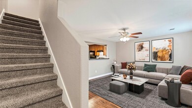 Living area featuring stairway, wood finished flo