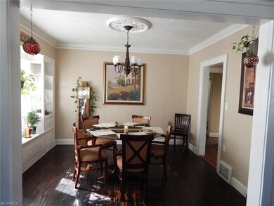 Dining room has a large window to let in the sun.