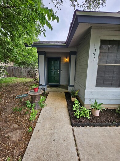 Doorway to property featuring fence