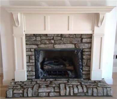 Rock gas log fireplace is just beautiful as the centerpiece of the living room!
