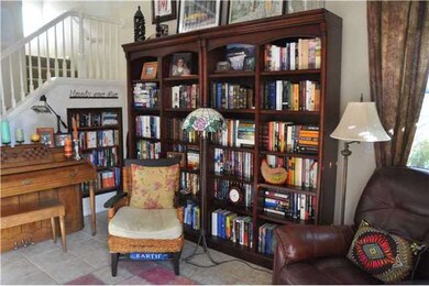 Living Room wine closet behind second book shelf