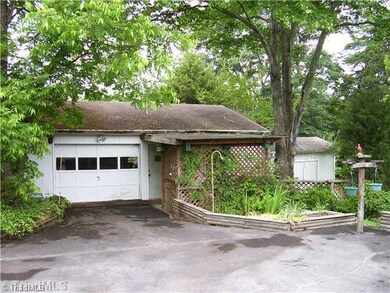 Parking Lot/Garage. Detached garage has room for car(s), storage, & work area.