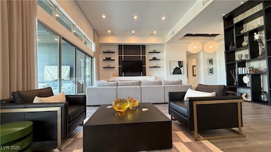 Living room with built in shelves and wood finishe
