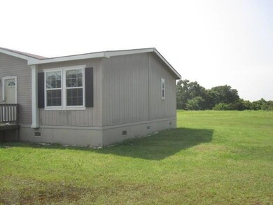 View of home's exterior featuring a lawn
