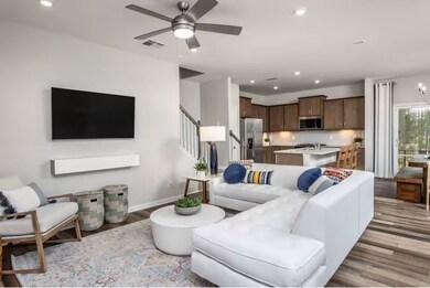 ***This photo was taken from a previously built Hemingway townhouse**  Great Room with Luxury Vinyl Plank throughout.