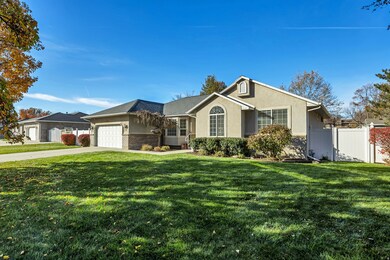 Single story home featuring concrete driveway, a garage, and stucco siding