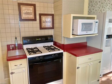 Remodeled kitchen with updated counters, dishwasher/disposal, gas range, built in microwave, refrigerator, LVT floors + more!