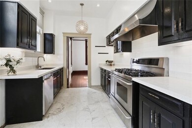 Stone countertops, stainless steel appliances and 