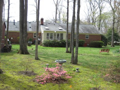 View of back yard and home