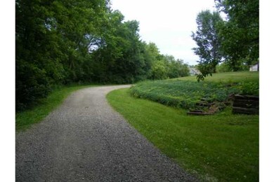 Exterior Front. Road entering the property
