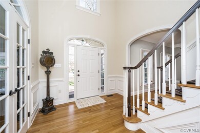 Foyer with view to office, living room and stairs