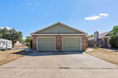 View of front of house featuring brick siding and
