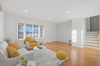 Bright and spacious living area with large picture